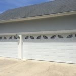 triple car garage with two doors
