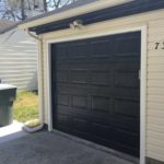 numbered house with garage door